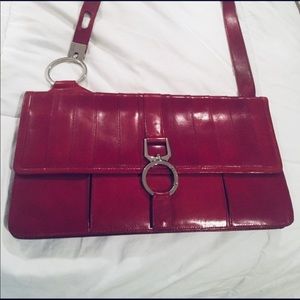 BCBGMaxAzria Red Crossbody Bag with Sleek Design and Silver Hardware